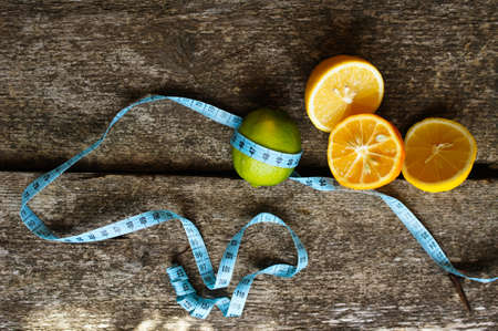 Lime and lemon different sorts on the wooden background, selective focus