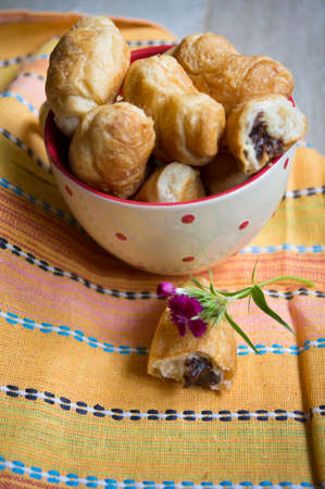 Croisant with chocolate and flowers の写真素材