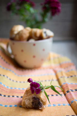 Croisant with chocolate and flowersの写真素材