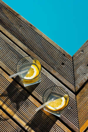 Gin and tonic cocktail on poolside barの写真素材