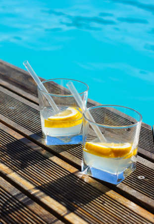 Gin and tonic cocktail on poolside barの写真素材