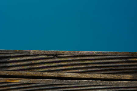 Outdoor pool in the tropical area with blue water and laderの写真素材