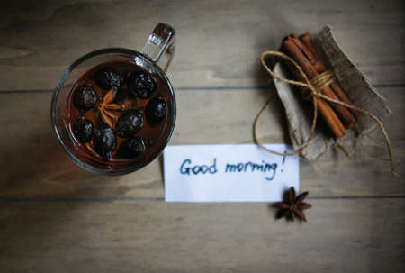 Rose hip tea with spices, cinnamon and anise star on the table