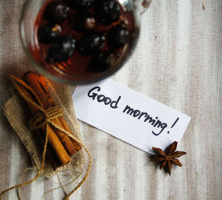 Rose hip tea with spices, cinnamon and anise star on the tableの写真素材