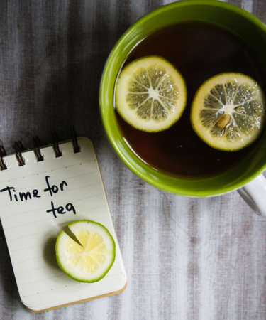 Mug with tea and lemon, and noteの写真素材