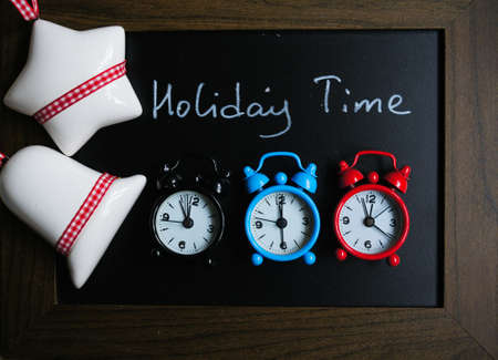 Chulk board with holiday time wishes and christmas decorationsの写真素材