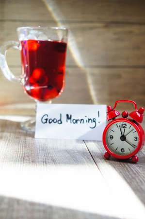 Hot hip tea with berries on the wood backgroundの写真素材