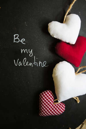 Hearts on the blackboard and note with chalkの写真素材