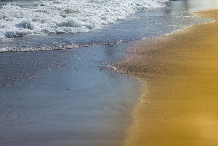 Soft wave of the sea on the sandy beachの写真素材