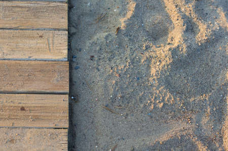 Wooden footbridge in the sand of a beach for access to the seaの写真素材