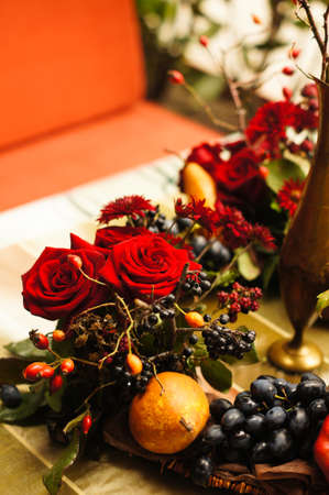 Autumn flowers and fruits in big composition