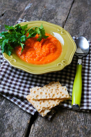 Healthy dinner, carrot cremme soup on the old wooden tableの写真素材