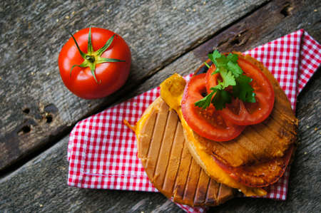 Homemmade hamburger with fresh tomatoes and cheeseの写真素材