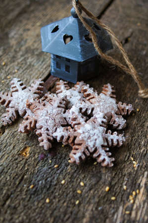 Christmas cookies snow flake shaped on a wooden backgroundの写真素材