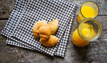 Helthy breakfast orange juice with croissants