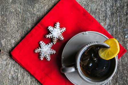 Chocolate muffins and cup of tea on the wooden backgroundの写真素材