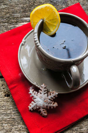Chocolate muffins and cup of tea on the wooden backgroundの写真素材
