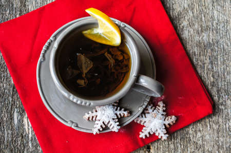 Chocolate muffins and cup of tea on the wooden backgroundの写真素材
