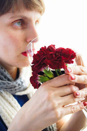 Beautiful woman in stripped scarf with red wine glass