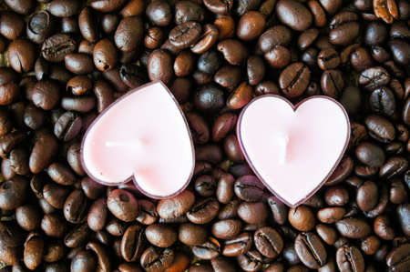 Cup of coffee and red cloves flowers in a vase with good morning noteの写真素材