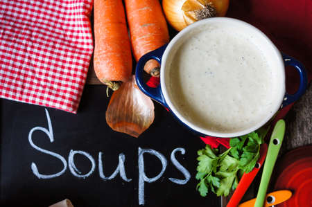 Traditional french onion cream soup on the wooden tableの写真素材