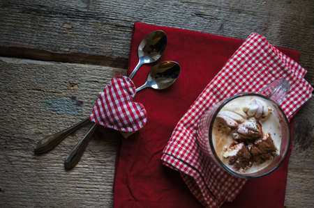 Cloeup of hot chocolate with marshmallows in a mug on napkin