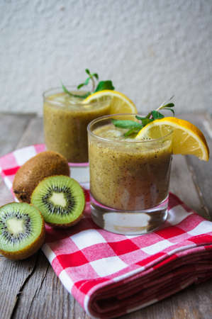 Healthy kiwi smoothie in a glass. Selective focusの写真素材