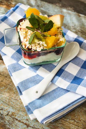 Oat flakes and fruit salad on wooden table. Selective focus,の写真素材