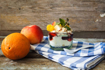 Oat flakes and fruit salad on wooden table. Selective focus,の写真素材