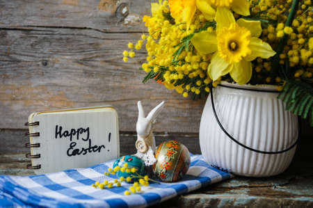 Easter time, spring flowers, easter eggs and  easter bunny