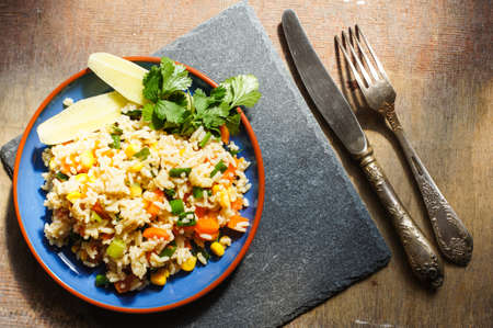 Healthy breakfast with rice and vegetables and orange juiceの写真素材