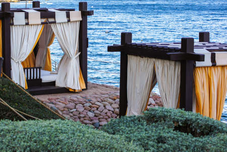 background of beach and sunbeds on the tropic beachの写真素材