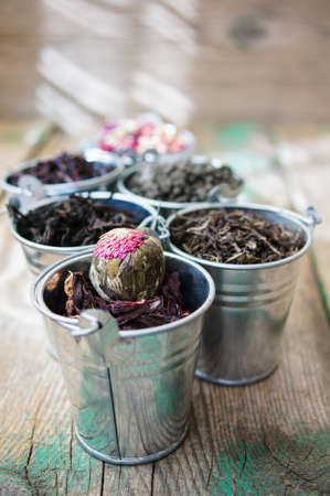 Different types of tea in the metal potsの写真素材