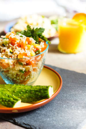 Healthy breakfast with rice and vegetables and orange juiceの写真素材