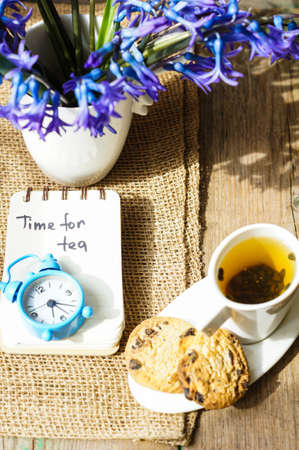 Cup of fresh herbal tea with mint on wooden tableの写真素材