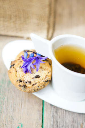 Cup of fresh herbal tea with mint on wooden tableの写真素材