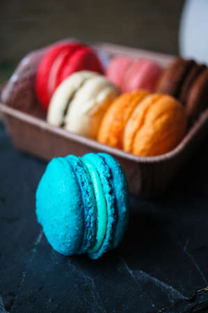 Colorful macaroons on old wooden backgroundの写真素材