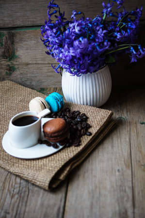 Colorful macaroons on old wooden backgroundの写真素材