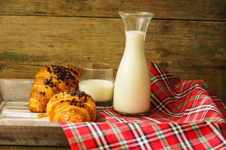 Breakfast time, fresh croissant with chocolate and milkの写真素材