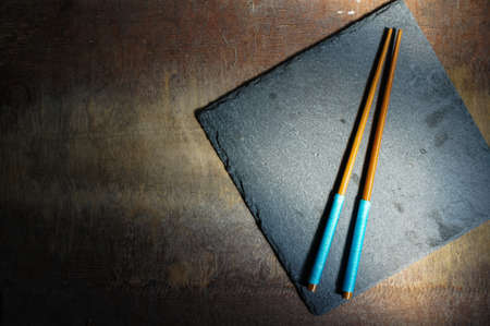 pair of chopsticks on rustic wooden backgroundの写真素材