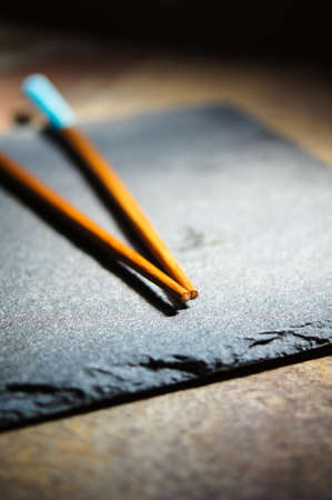 pair of chopsticks on rustic wooden background