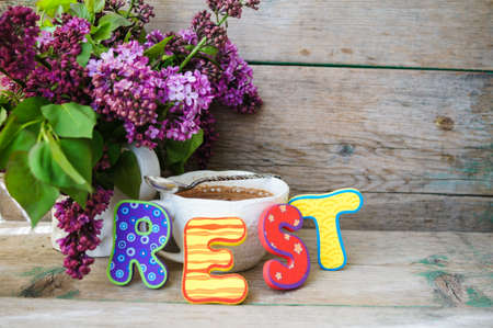 Spring time, lowers o lilac in a pot in the rustic style interiorの写真素材