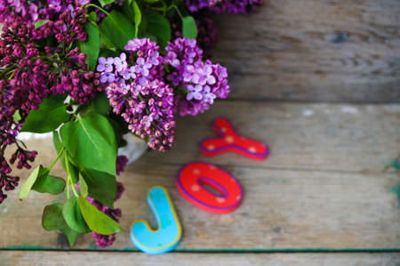 Spring time, lowers o lilac in a pot in the rustic style interiorの写真素材