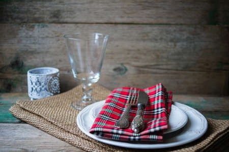 Table Setting with napkin and silverware on wooden tableの写真素材