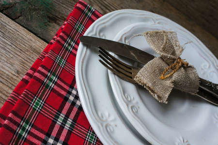 Table Setting with napkin and silverware on wooden tableの写真素材