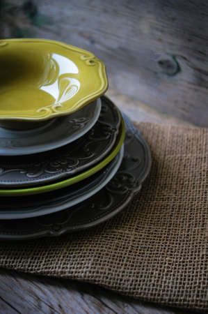 Vitage plates on the wooden tableの写真素材