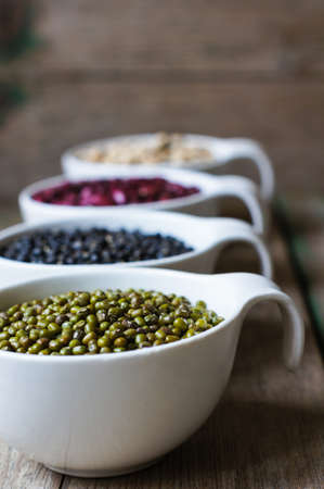 Four types of dry beans in the bowlの写真素材