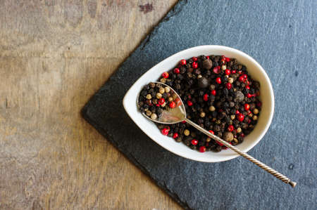 An assortment of different types of pepper grainの写真素材