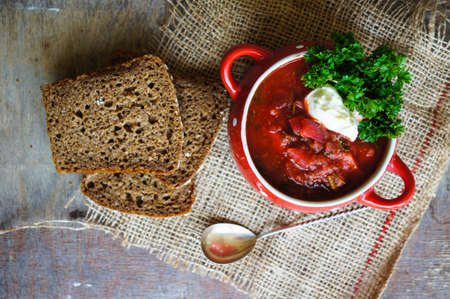 Traditional ukrainian soup - borsch, on the woodenn tableの写真素材