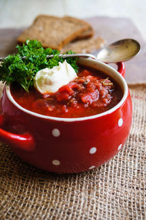 Traditional ukrainian soup - borsch, on the woodenn tableの写真素材